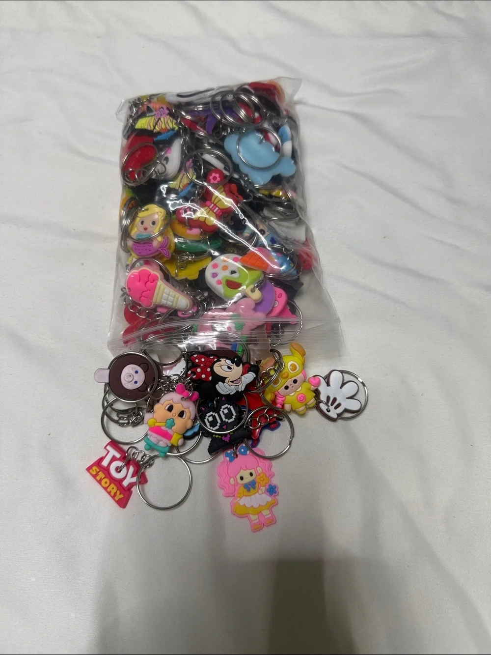 100 Assorted Cartoon Keychain Charms - Pink, Yellow, Red, Blue, White